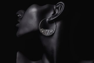 Fine jewelry promotion in the ears of a woman. High quality photo